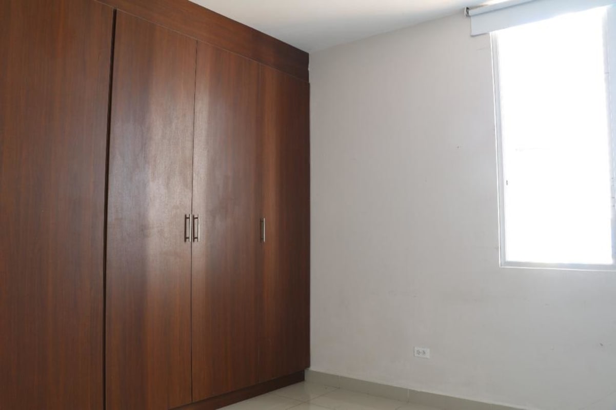 Minimalist bedroom with natural light wooden wardrobe PH Cangrejo Bay Panama