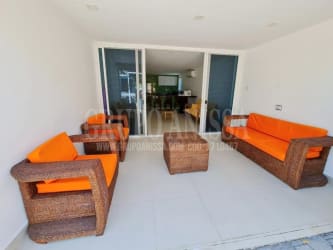 Kitchen with green tiles, breakfast counter, appliances in Punta Chame Panama townhouse