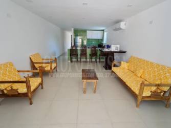 Open living dining area with tile floors leading to terrace in beach townhouse Panama