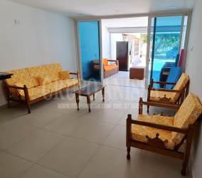 Large infinity pool with palm trees overlooking beach at Punta Chame Resort Panama