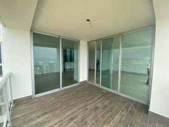 Contemporary balcony with glass railings overlooking ocean at Río Mar Tower 3 Panama