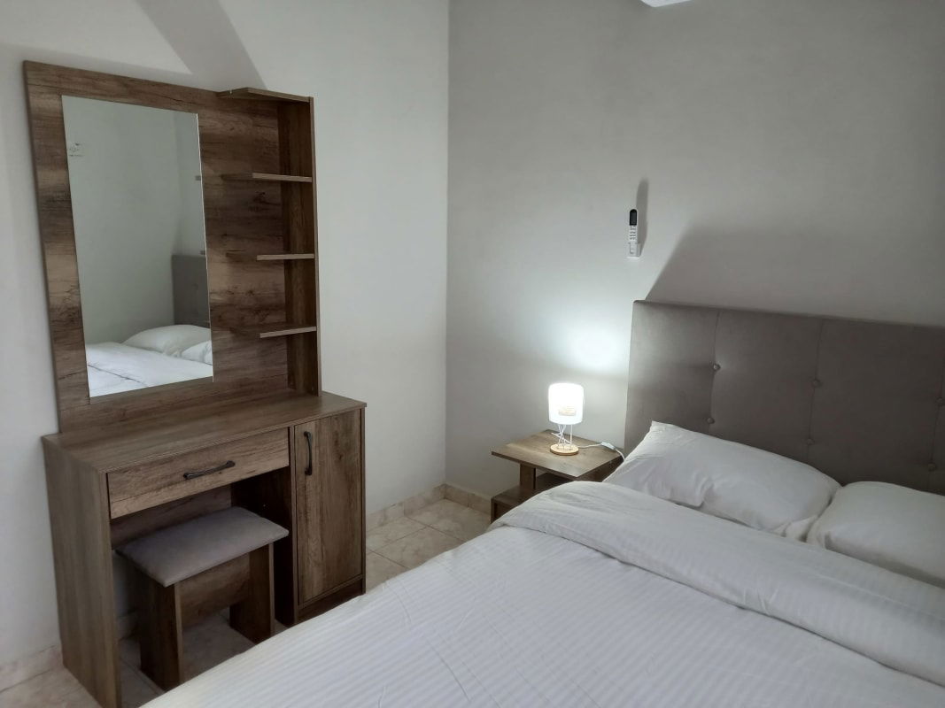 Dining area with four-seat wooden table, tiled floor Panama Pedregal