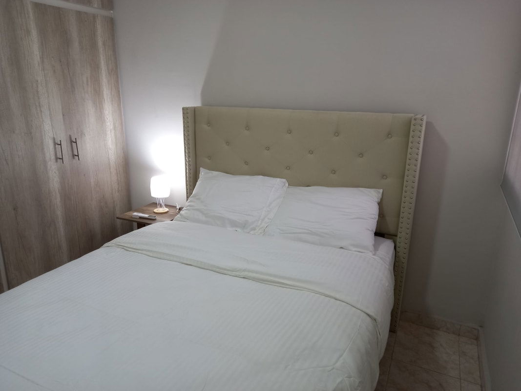 Furnished bedroom with air conditioner, upholstered headboard Puerta del Este Panama City