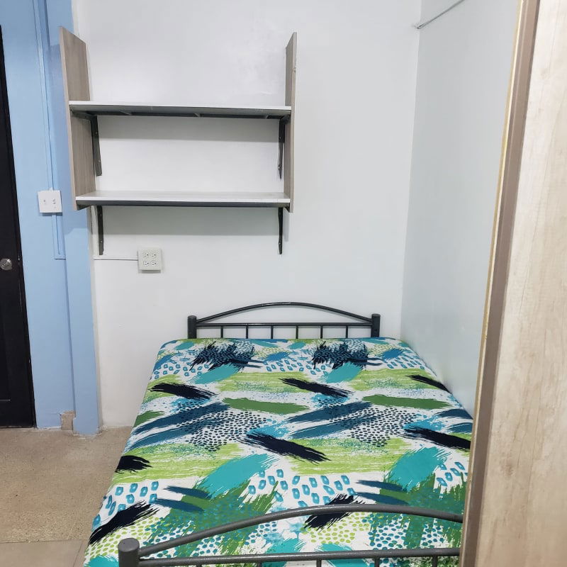 Compact room with en-suite tiled bath, bed and storage in PH Via España El Cangrejo Panama