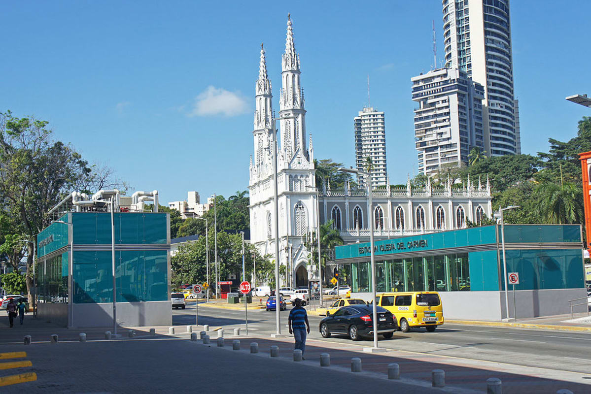 Neo-gothic Iglesia del Carmen Church alongside modern towers in El Cangrejo Panama City