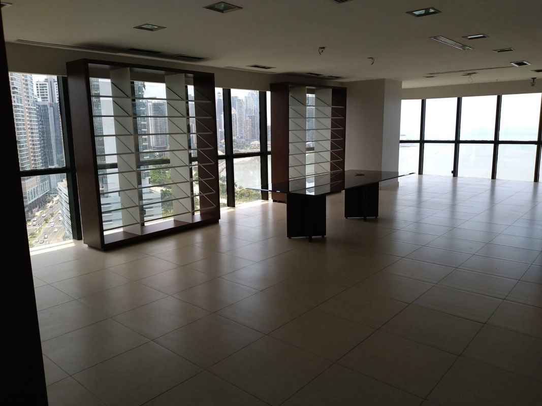 Large office space with floor-to-ceiling windows overlooking marina and ocean in PH BAC Tower