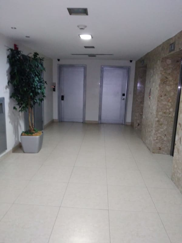 Modern lobby with elevators tile floors marble accents PH BAC Tower Panama