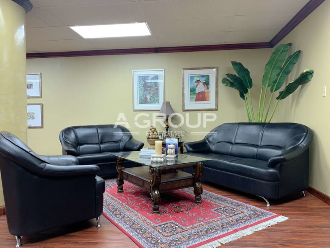 Reception area with sofas, artwork, and decorations PH Bay Mall Avenida Balboa Panama