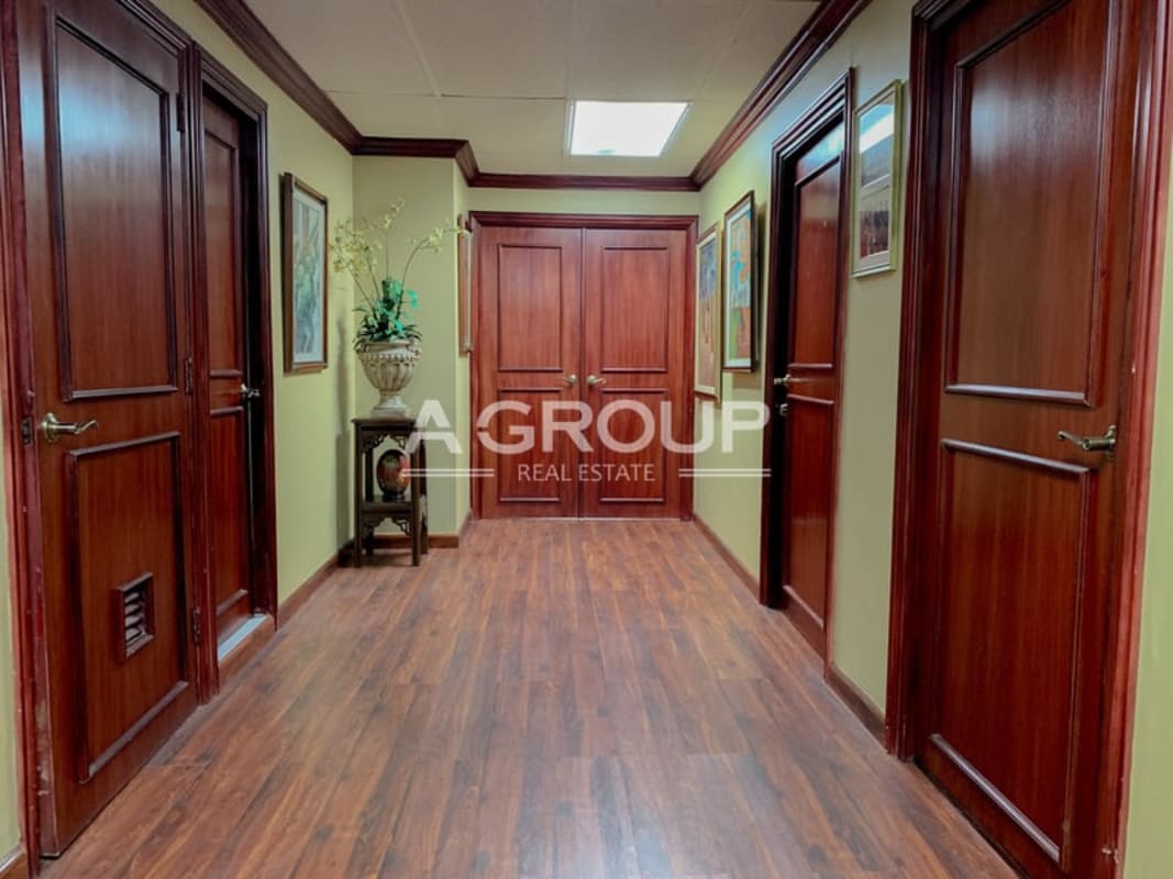 Office hallway with wooden doors and art decor PH Bay Mall Avenida Balboa Panama