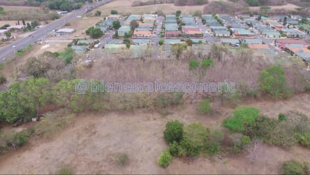 Flat land adjacent to residential neighborhood and paved street Los Santos Panama