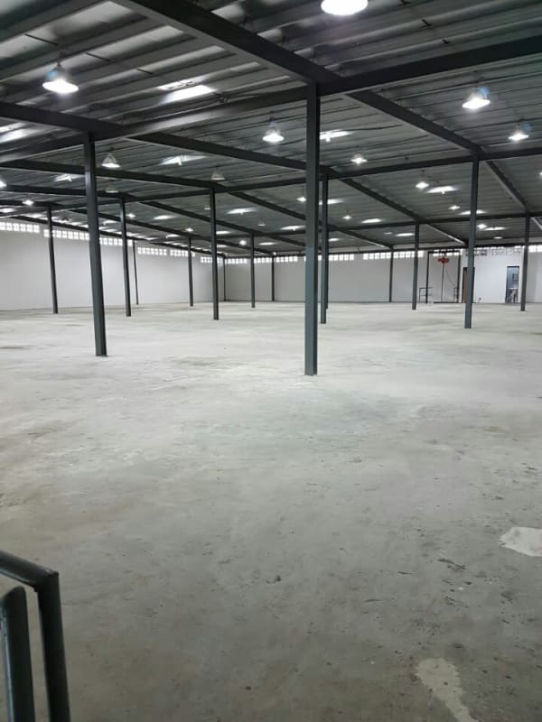 Main entrance of warehouse with fenced gate and loading area in Panama City Juan Díaz