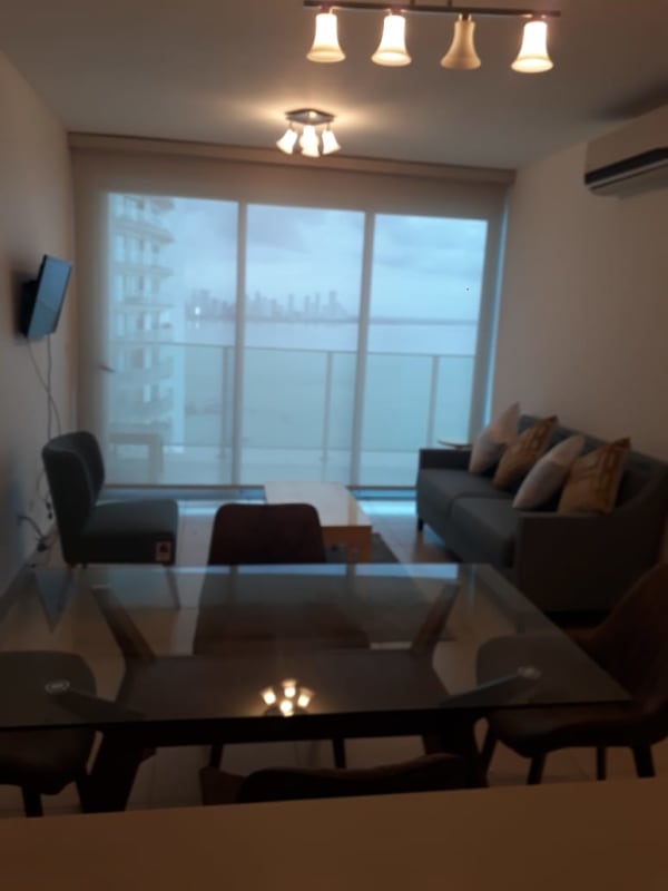 Living room large windows natural light ocean view Punta Pacifica Panama