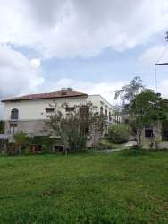 Land lot with grass and mountain backdrop across from Hotel Los Mandarinos El Valle Panama