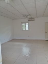 Bright living area tiled floors ceiling fan in Rincón del Paraíso apartments Río Hato Panama