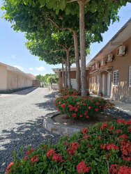 Landscaped garden courtyard walkway at Rincón del Paraíso apartments Río Hato Panama