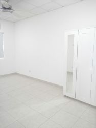 Minimalist bedroom with built-in wardrobe, tiled floors, ceiling fan, split AC in Rincon del Paraiso Rio Hato