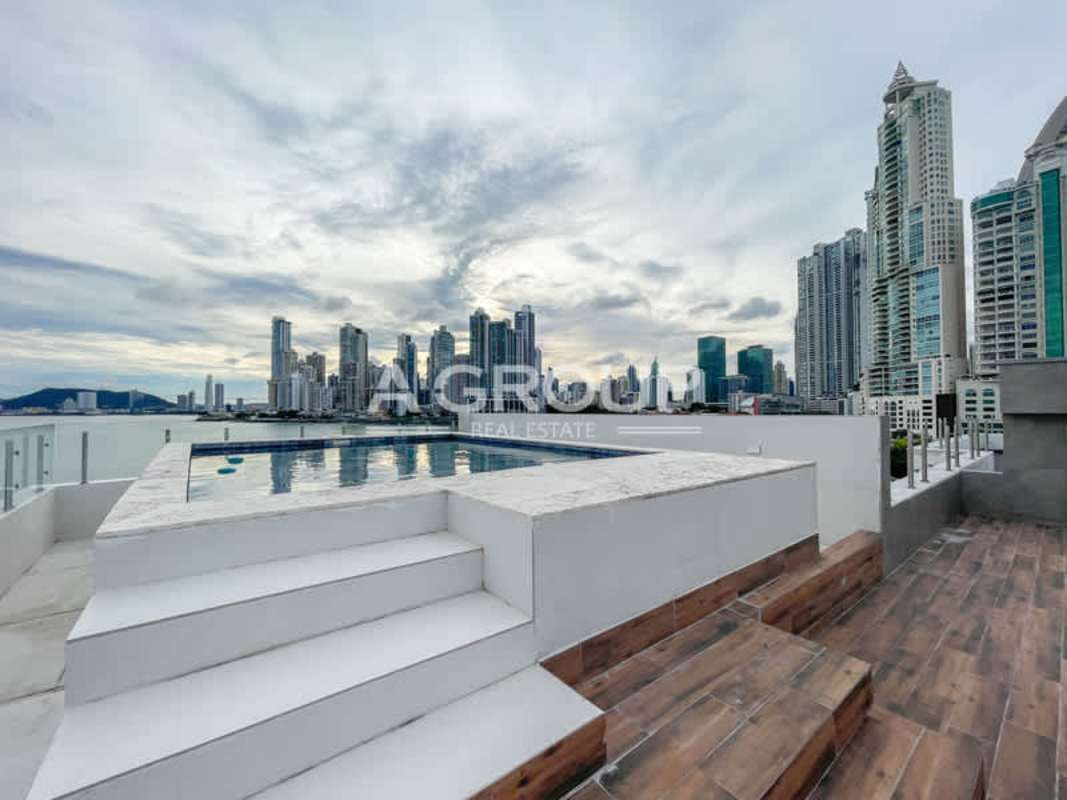 Large private rooftop terrace with panoramic ocean and skyline views in Ocean Reef penthouse Panama City