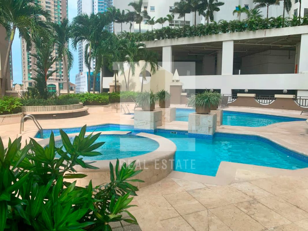 Large balcony with glass railing overlooking Pacific Ocean Punta Pacifica luxury apartment