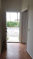 Modern minimalist bathroom with pedestal sink mirror and hot water shower Rincon del Paraiso Rio Hato Panama