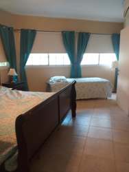 Furnished bedroom with double bed, AC, closet in beachfront home Coronado Panama