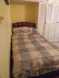 Covered outdoor patio with lounge and dining set at tropical Coronado rental Panama