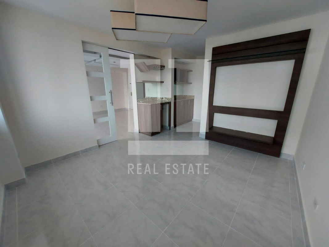 Living room view with floor to ceiling windows and city skyline PH Brisas de Marbella Panama