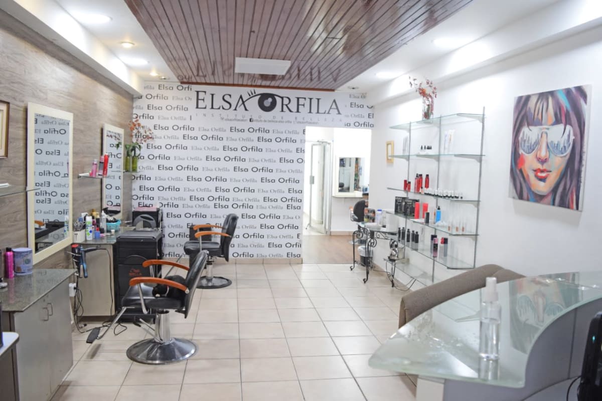 Shop interior with styling chairs, mirrors and wood ceiling panels commercial Panama