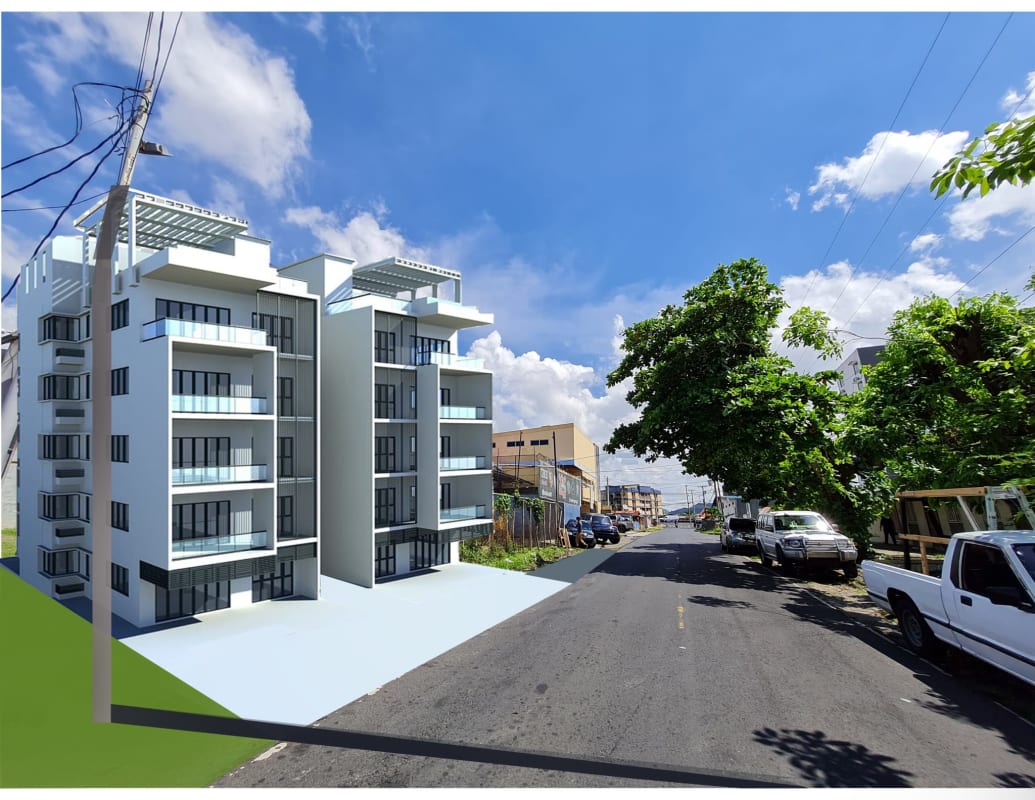 New modern apartment building with glass balconies next to development lot Rio Abajo Panama