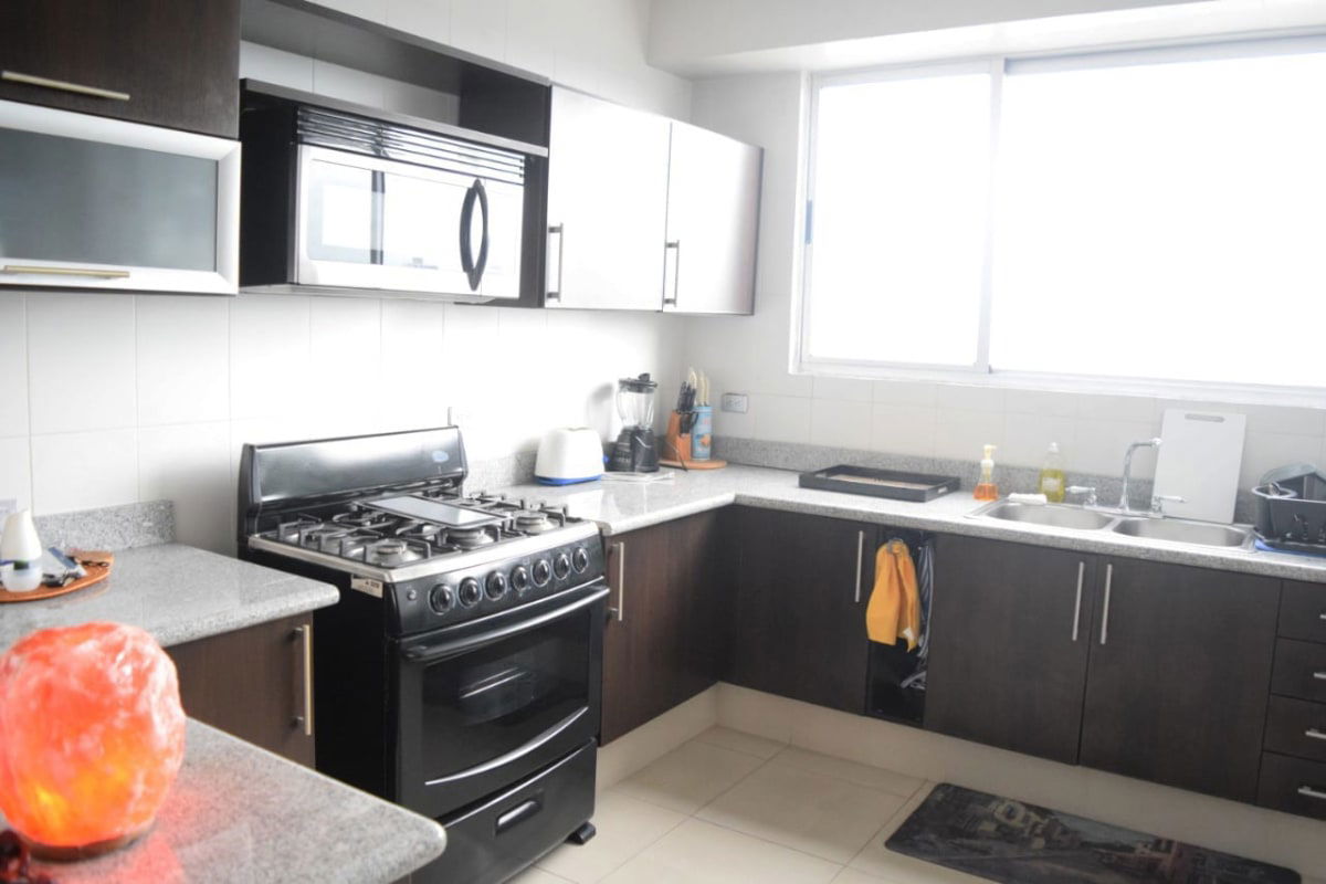 Functional kitchen with granite counters large window and appliances PH Window Tower San Francisco Panama