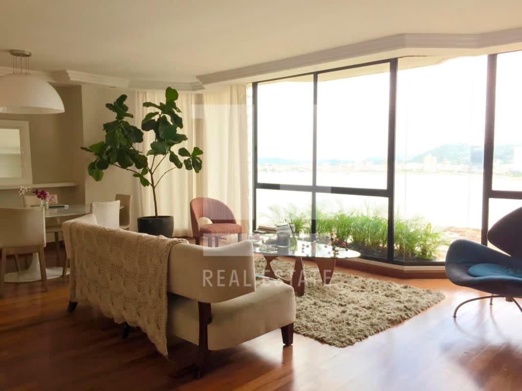 Bright dining area with panoramic windows and water views at PH Mediterranee Punta Paitilla