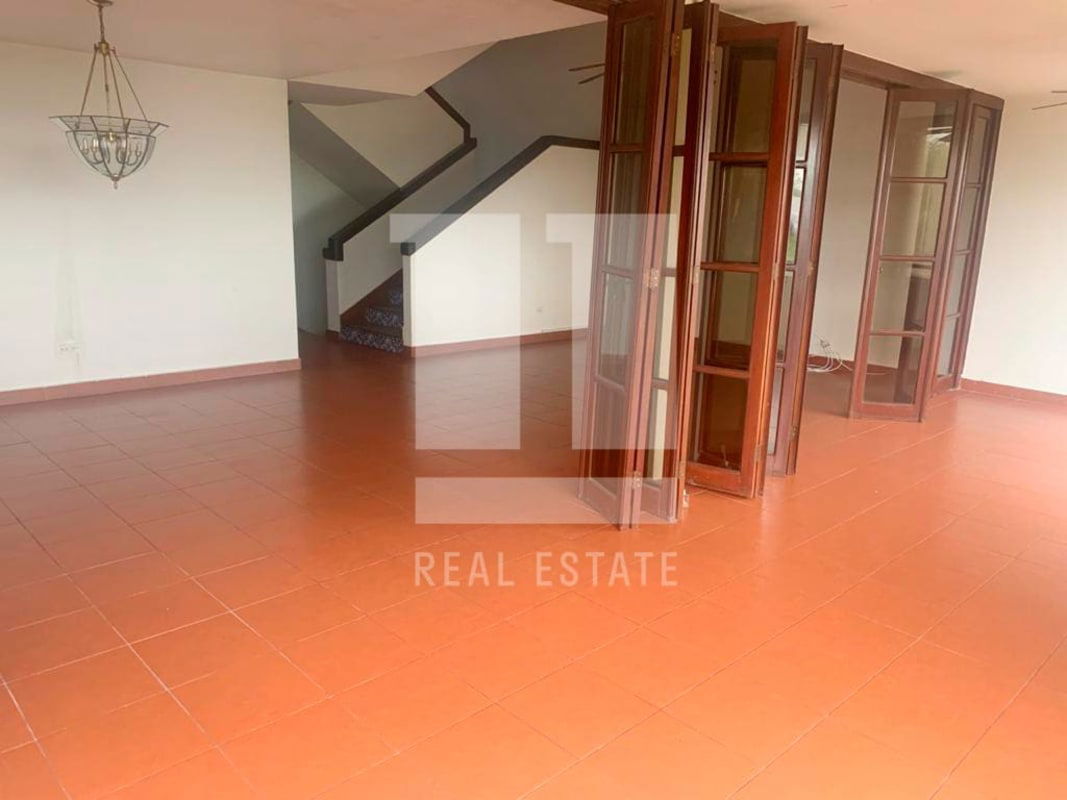 Interiors with staircase featuring decorative tiles in Dos Mares Panama house for sale