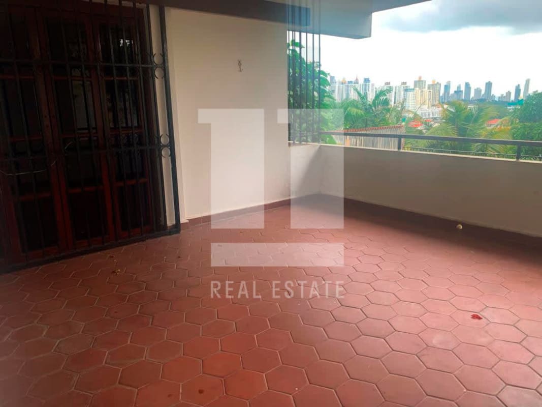 Balcony terrace with terracotta tiles and city skyline view from Dos Mares multi-level house Panama City