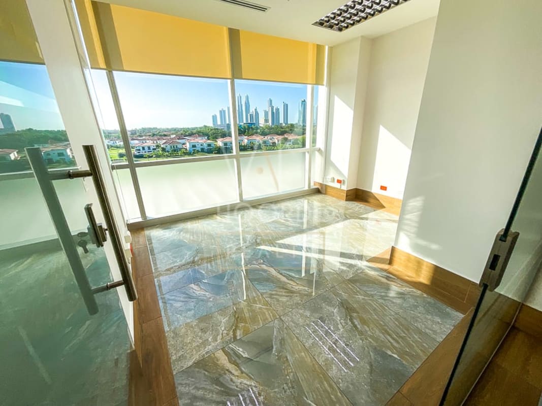 Office room with panoramic golf view through large windows Torre Arifa Santa María Panama