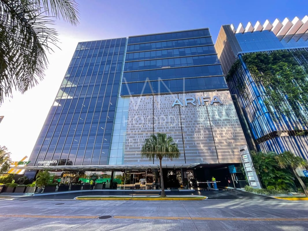 Modern glass office tower with vertical garden elements in Santa María Business District Panama City