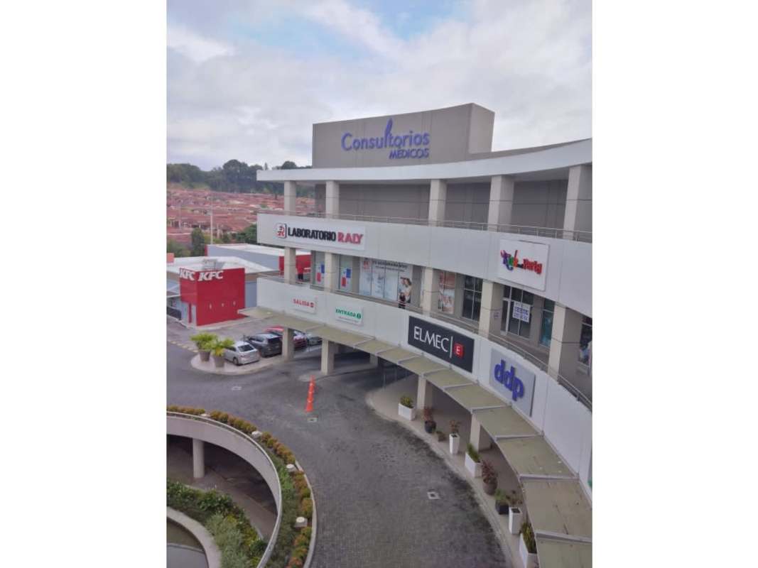 Exterior view with water fountain and landscaped retail storefronts at Signature Plaza Brisas del Golf Panama