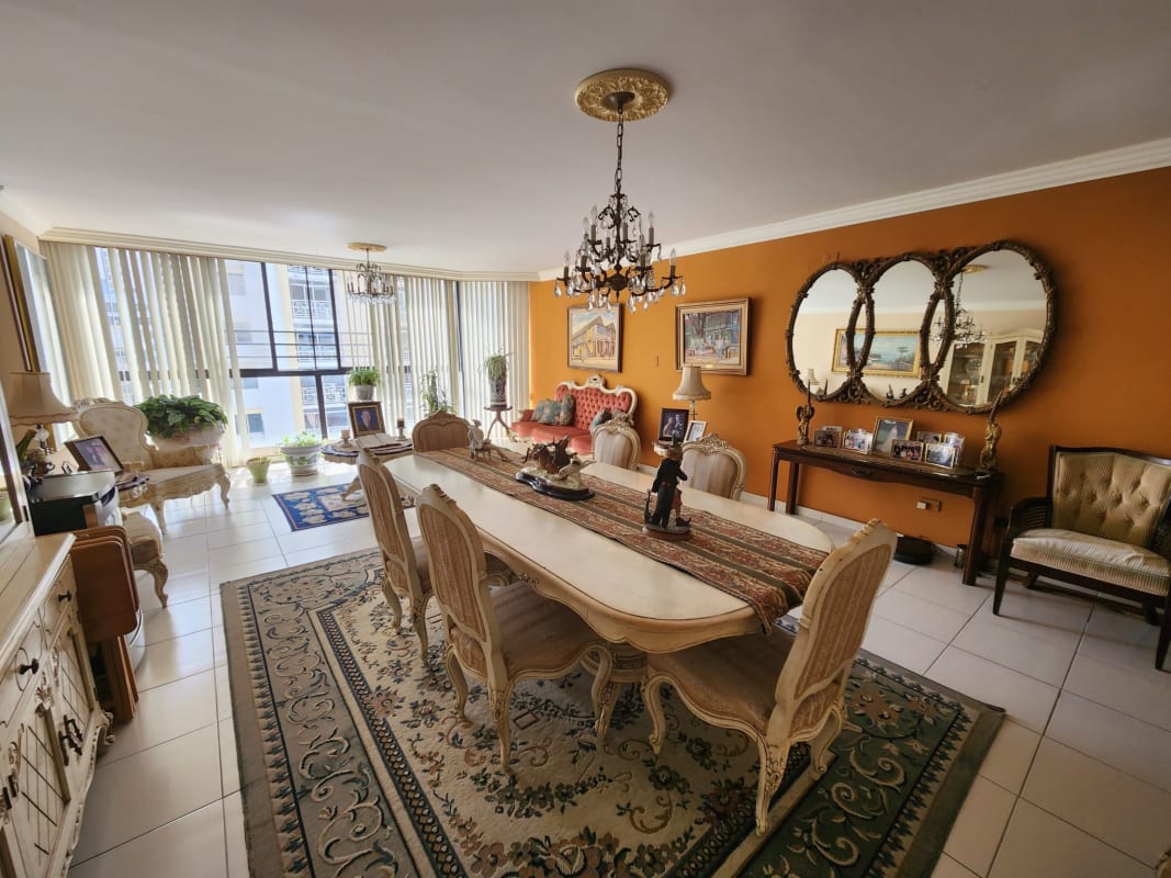 Dining room with large windows, classic furniture and chandeliers at Terrazas del Cangrejo El Cangrejo Panama City