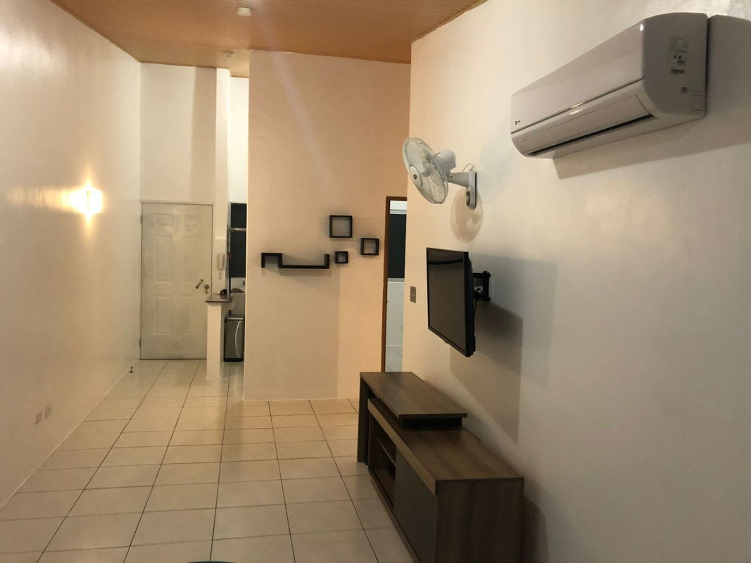 Outdoor pool area with deck lounge in PH Llano Bonito gated community Panama Juan Diaz