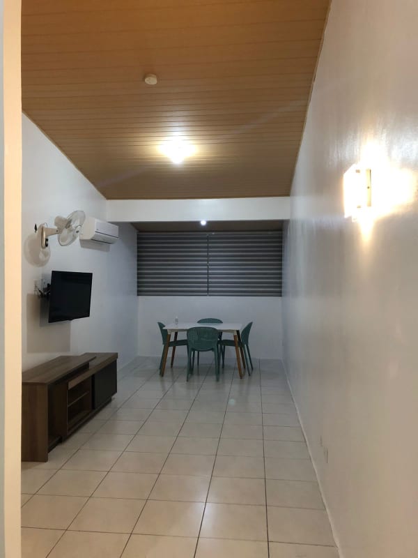 Open plan living dining room tiled floors split AC white walls PH Llano Bonito Panama