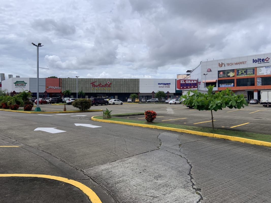 Shopping center storefronts parking landscaping at Los Pueblos Juan Díaz Panama City