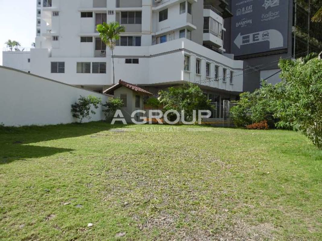 Street view with high-rise commercial buildings and parking area around commercial property Marbella Panama