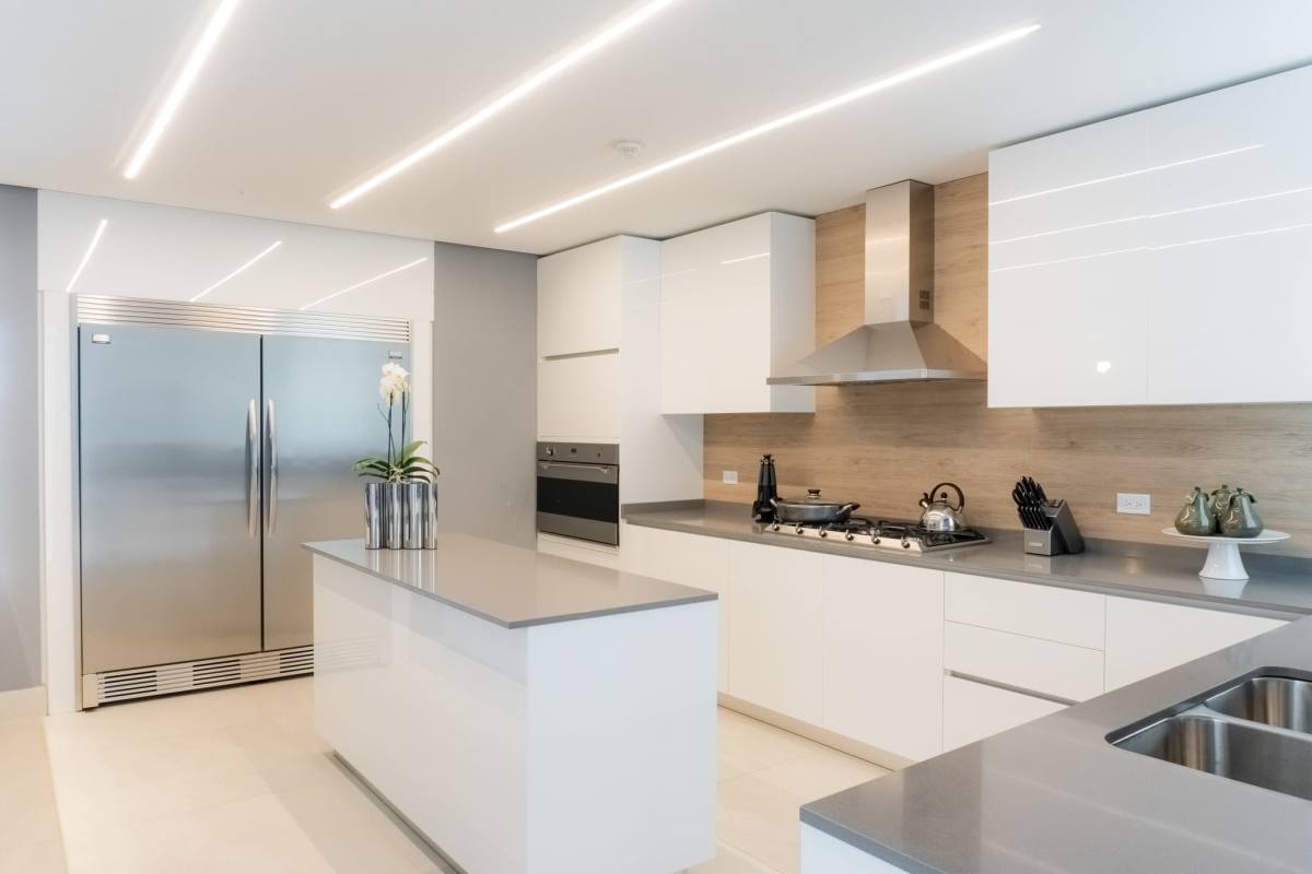 Spacious modern kitchen with island ready for customization in Riviera del Golf apartments Panama