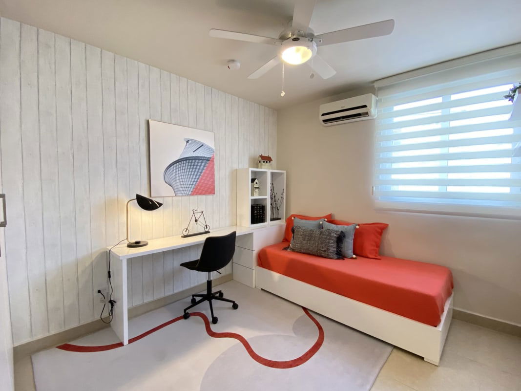 Cozy bedroom with twin beds, light decor in Versalles condo Panama City