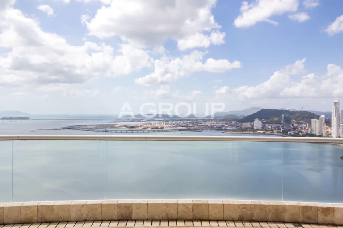 Modern skyscraper high-rise with multiple balconies and palm trees Punta Paitilla Panama