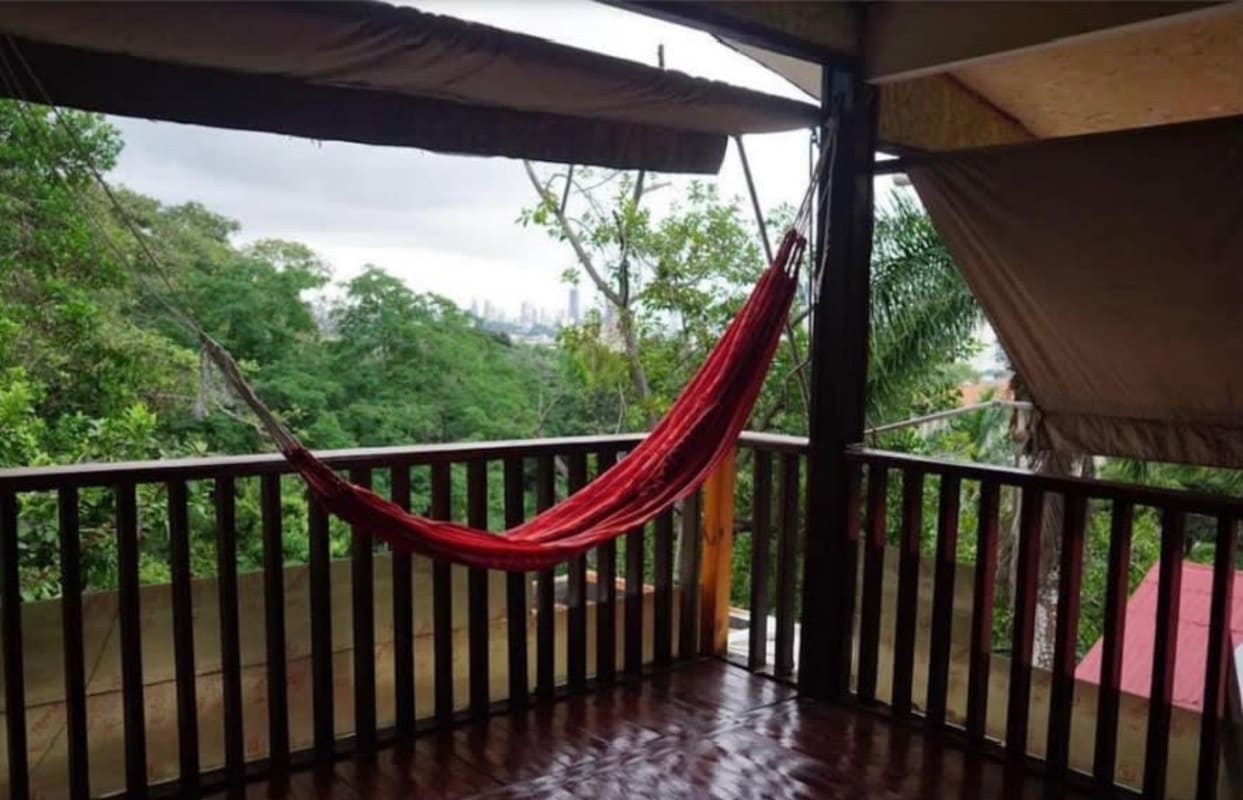 Spacious art studio with large windows, wooden floors, natural light and forest view in Herrick Heights Ancon Panama