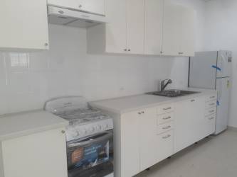 Minimalist bathroom with white fixtures in Rincon del Paraiso, El Farallón, Antón, Panama
