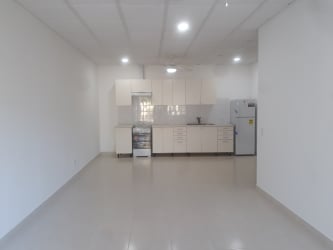 Minimalist kitchen with white cabinets, option for stove and fridge in Rincon del Paraiso, El Farallón, Panama
