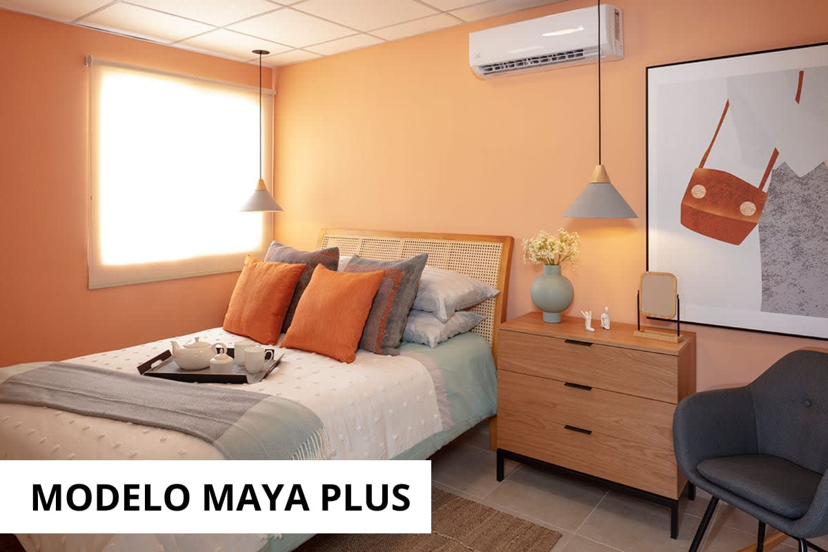 Dining area with round table open to kitchen in Montemadero sample home Panama