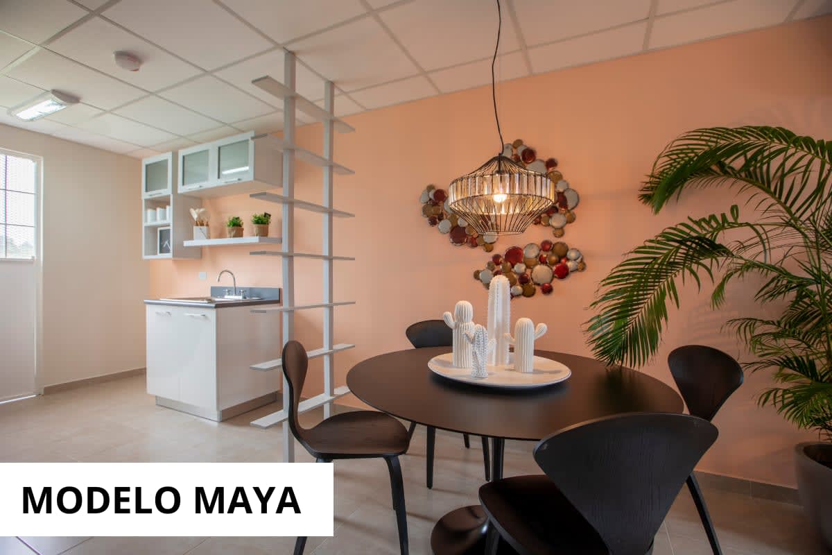 Modern minimalist living room with gray sectional and peach wall Montemadero Panama