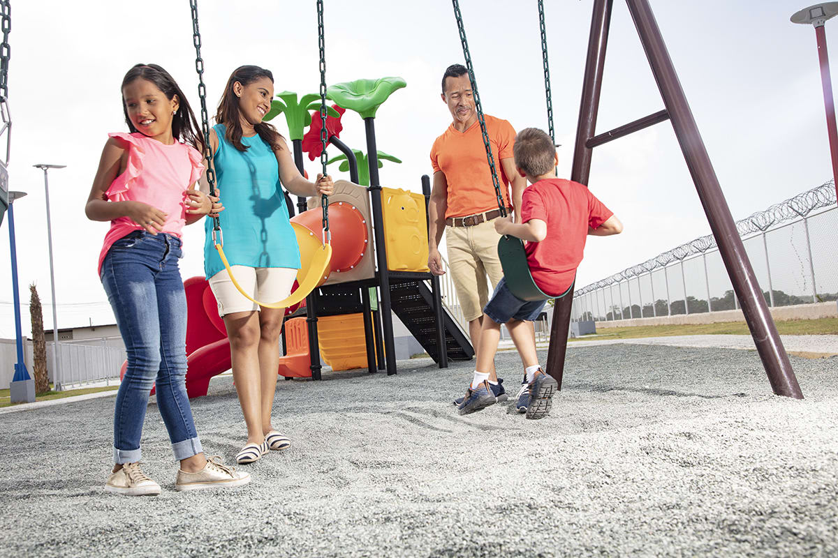Families enjoying BBQ area with playground Montemadero Panama development