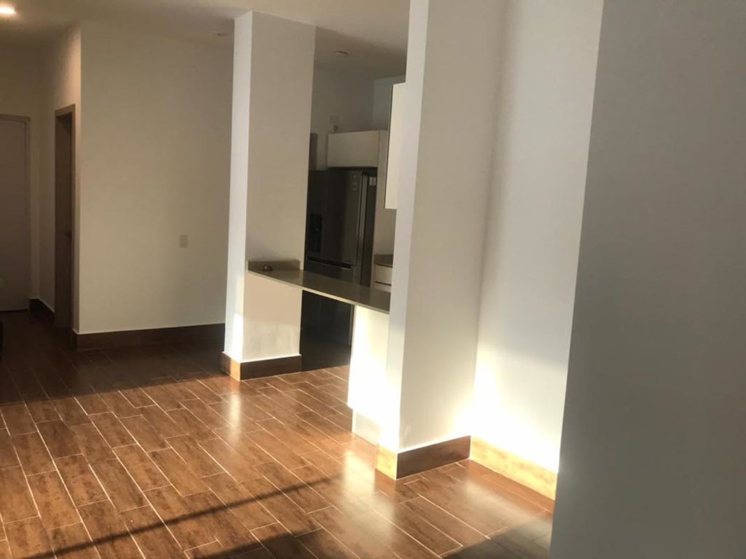 Bright living dining room with porcelain tile floors at PH Costamare Costa Sur Panama